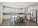 Modern kitchen with stainless steel appliances, a breakfast bar, and bright natural light at 1671 Indy Dr, North Charleston, SC 29405