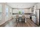 A modern, bright kitchen with stainless steel appliances and an island with seating at 1671 Indy Dr, North Charleston, SC 29405
