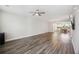 Open-concept living room with hardwood floors and a view of the modern kitchen at 1671 Indy Dr, North Charleston, SC 29405