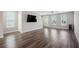 An open-concept living room with hardwood floors and lots of natural light at 1671 Indy Dr, North Charleston, SC 29405