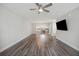 Bright living room with hardwood floors and a view of the kitchen with an island at 1671 Indy Dr, North Charleston, SC 29405