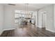 Open-concept living room flows into a kitchen with island seating and stainless steel appliances at 1671 Indy Dr, North Charleston, SC 29405
