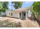 A screened in porch extends from the back of this home with a well maintained and level yard at 172 Ashton Dr, Goose Creek, SC 29445