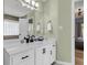Bright bathroom with a white vanity, matte black hardware, and decorative light fixture at 172 Ashton Dr, Goose Creek, SC 29445