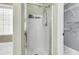 Shower stall with glass door in bathroom with modern shower head and wall mounted caddy at 172 Ashton Dr, Goose Creek, SC 29445