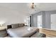 Spacious bedroom showcasing a large bed, shiplap wall, and ensuite bathroom access at 172 Ashton Dr, Goose Creek, SC 29445