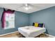 Well-lit bedroom with a comfortable queen bed and contemporary blue walls at 172 Ashton Dr, Goose Creek, SC 29445