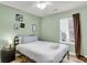Cozy bedroom offers a comfortable bed, soft lighting, and a large window for natural light at 172 Ashton Dr, Goose Creek, SC 29445
