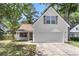 Charming home featuring a classic design, well-maintained lawn, and a two-car garage, perfect for a growing Gathering at 172 Ashton Dr, Goose Creek, SC 29445