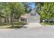 Charming exterior with a well-manicured lawn, featuring a two-car garage and classic architectural details at 172 Ashton Dr, Goose Creek, SC 29445