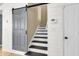 Inviting hallway showcasing a stylish sliding barn door leading to stairs and bright white trim at 172 Ashton Dr, Goose Creek, SC 29445