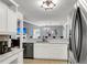 Well-appointed kitchen with stainless appliances, marble countertops, and open view to living area at 172 Ashton Dr, Goose Creek, SC 29445
