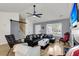 Inviting living room with a large black leather sectional, vaulted ceiling, and wood flooring at 172 Ashton Dr, Goose Creek, SC 29445
