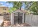 A well maintained shed for extra storage space behind home with brown double doors and window at 172 Ashton Dr, Goose Creek, SC 29445