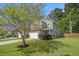 Inviting two-story home with a well-kept lawn, a two-car garage, and lush landscaping at 1723 Indaba Way, Charleston, SC 29414