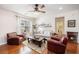 Cozy living room featuring hardwood floors, comfortable seating, and a decorative fireplace at 1723 Indaba Way, Charleston, SC 29414