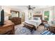 Stylishly furnished bedroom with wood accents, a ceiling fan, and natural light at 1723 Indaba Way, Charleston, SC 29414