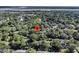 Aerial view highlighting the property's location amidst lush greenery and mature trees at 1730 Harrison Ave, Charleston, SC 29407