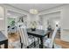 Elegant dining room with a modern chandelier, stylish chairs, and an open layout at 1730 Harrison Ave, Charleston, SC 29407