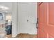 View of the foyer with light hardwood floors and an open doorway leading to the living area at 1730 Harrison Ave, Charleston, SC 29407