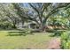 Charming home with a sprawling front yard shaded by mature trees at 1730 Harrison Ave, Charleston, SC 29407