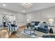 Open-concept living room with stylish furniture, hardwood floors, and ample natural light at 1730 Harrison Ave, Charleston, SC 29407