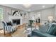 Elegant living room featuring a fireplace, hardwood floors, and stylish, neutral-tone decor at 1730 Harrison Ave, Charleston, SC 29407