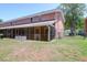 Spacious backyard with an enclosed porch and manicured green grass at 1816 Mepkin Rd # B1, Charleston, SC 29407