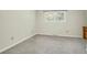 Bright bedroom with neutral carpet, window, and light-colored walls at 1816 Mepkin Rd # B1, Charleston, SC 29407
