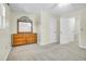Bedroom with neutral carpet, ceiling fan, and a dresser with mirror at 1816 Mepkin Rd # B1, Charleston, SC 29407