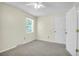Comfortable bedroom with neutral walls, soft carpeting, and a bright window, offering a cozy place to rest and recharge at 1816 Mepkin Rd # B1, Charleston, SC 29407