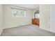 Bedroom featuring light colored walls, carpet, and a dresser with mirror at 1816 Mepkin Rd # B1, Charleston, SC 29407
