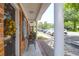 Charming brick condo features a cozy front porch with chairs and a welcoming view into the neighborhood at 1816 Mepkin Rd # B1, Charleston, SC 29407