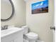 Half bathroom features a modern vanity with white countertops, stylish mirror, and contemporary fixtures at 1816 Mepkin Rd # B1, Charleston, SC 29407