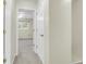 Hallway that flows into a bedroom with soft carpeting and bright, natural light pouring in from the windows creating an airy feel at 1816 Mepkin Rd # B1, Charleston, SC 29407