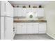 Kitchen featuring all-white appliances, cabinets and a neutral countertop, plus a decorative wreath and ample storage space at 1816 Mepkin Rd # B1, Charleston, SC 29407