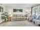 Inviting living room with hardwood floors, neutral paint, plush rug, and cozy sofa creates a warm and welcoming ambiance at 1816 Mepkin Rd # B1, Charleston, SC 29407