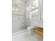 Modern bathroom featuring marble walk-in shower and sleek vanity with integrated sink at 19 Smith St # B, Charleston, SC 29401