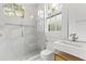 Modern bathroom featuring marble walk-in shower and sleek vanity with integrated sink at 19 Smith St # B, Charleston, SC 29401