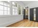 Bright bedroom features hardwood floors, natural light, and an ensuite bathroom at 19 Smith St # B, Charleston, SC 29401