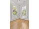 Corner bedroom with lots of natural light showcasing charming windows and hardwood floors at 19 Smith St # B, Charleston, SC 29401
