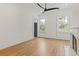 Light-filled bedroom with natural lighting, high ceilings, fireplace and wood floors at 19 Smith St # B, Charleston, SC 29401