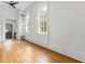 Bright bedroom with refinished hardwood floors, modern ceiling fan, and built-in shelving at 19 Smith St # B, Charleston, SC 29401