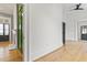 Hallway with view of decorative fireplace and bold geometric wallpaper at 19 Smith St # B, Charleston, SC 29401