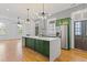 Open concept kitchen with an island, modern appliances, and an abundance of natural light at 19 Smith St # B, Charleston, SC 29401