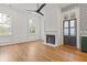Airy living room with natural light, fireplace, and views of the yard through large windows at 19 Smith St # B, Charleston, SC 29401