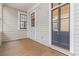 Cozy front porch with traditional windows and doors, offering a relaxing outdoor space at 19 Smith St # B, Charleston, SC 29401