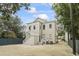 Two-story home featuring a backyard and stairwell leading to the second-story entrance at 19 Smith St # B, Charleston, SC 29401