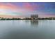 Beautiful lake reflecting a sunset sky and buildings, in a picturesque community setting at 19 Smith St # C, Charleston, SC 29401