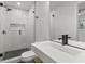 Modern bathroom featuring a glass-enclosed shower, sleek fixtures, and a contemporary sink at 19 Smith St # C, Charleston, SC 29401